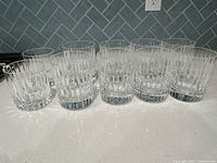 Front view of all 10 crystal whiskey glasses in a row