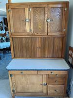 Full view of Hoosier cabinet showing upper doors, tambour, enamel work surface, lower cabinets and drawers
