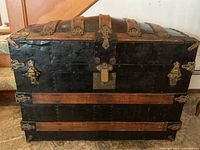 Front view showing wood slats, metal panels and hardware