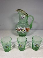 Pitcher front with three matching tumblers