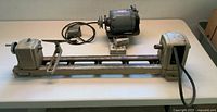 Overall view of lathe frame and motor on table