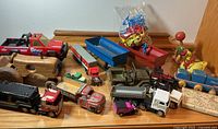 All toys laid out together on wooden surface