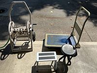 All items together: Suncast hose reel, platform dolly, round stool, step stool