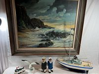 Overall lot with framed seascape, sailboat, seagull, small boat and figurines