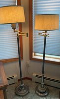 Both floor lamps showing full height, shades, swing arms and relative sizes