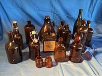 Group shot of all 14 amber bottles and jars
