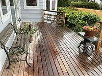 Bench, stove with planter, porch context