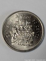 Reverse showing Canadian coat of arms and denomination
