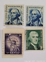 Front view of all four stamps
