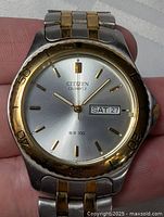 Front view of Citizen WR100 watch face showing dial, bezel and bracelet