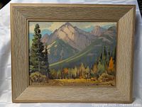 Framed oil landscape painting showing full frame