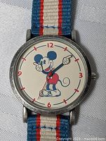 Front view of Mickey Mouse watch showing dial and strap