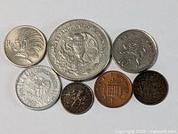 Group shot of seven assorted world coins