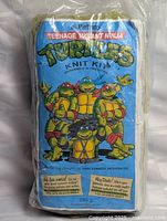 Front view of sealed Teenage Mutant Ninja Turtles knit kit packaging