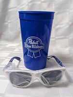 Cup and sunglasses together