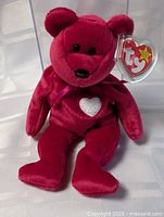 Full front view of red Ty Beanie Baby teddy bear with heart patch