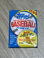 Front of sealed 1989 Topps MLB wax pack showing branding and card/gum count
