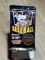 Front of sealed 1995 Topps Series 1 baseball card pack on stand