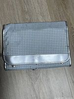 Front view of folded bag showing exterior material and flap