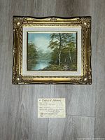 Framed oil painting with certificate below