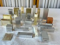 Wide view of all boxed skincare products on table showing quantity and variety