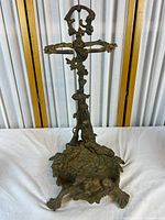 Full view of brass hunting stick stand showing overall form