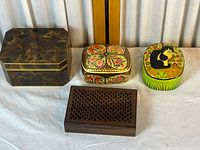 all four boxes side by side showing designs and sizes