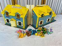 House open with accessories spread in front