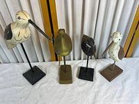 Four shorebird sculptures front view