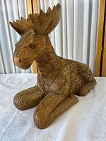 Full view of wooden moose figurine front left