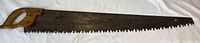 Full view of 42" serrated timber saw with wooden handle