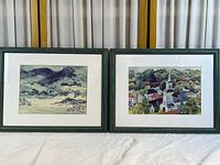 Both framed prints side by side