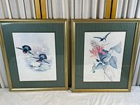 Both framed prints side by side