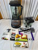 Full set including motor base, pitchers, blades, manuals and book