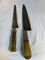 Both knives full view on cloth background