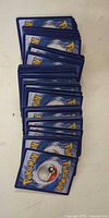 Stack of Pokémon card backs showing quantity