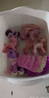 Top view of five My Little Pony figures in tub