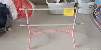 Full view of pink ballet barre stand front