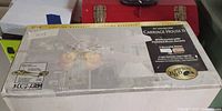 Sealed box showing Carriage House II ceiling fan packaging