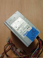 Top view showing label identifying HIPRO HP-150CLXA6 Rev:01 90W PSU
