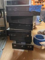 Front view of stacked internal optical drives showing logos and brands