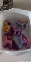 All five My Little Pony figures in tub