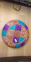 Top view showing full circular patchwork pattern and colors