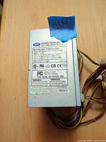 Label side showing model, ratings, serial, wire leads