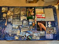 overview of beads, findings, tools, books on blue tarp