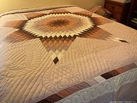 Quilt on bed showing full Lone Star pattern and border