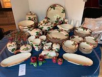 Full 73-piece Franciscan Desert Rose set displayed on table