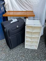 Overbed table, suitcase and shoe organizer grouped