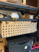 Stack of machined maple blocks on shelving