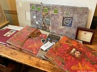 Group shot of all scrapbooks, frame and accessories on table